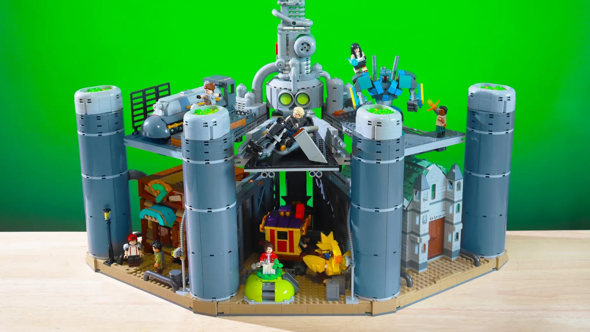 A Lego Midgar Final Fantasy 7 set on a wooden surface, against a green background