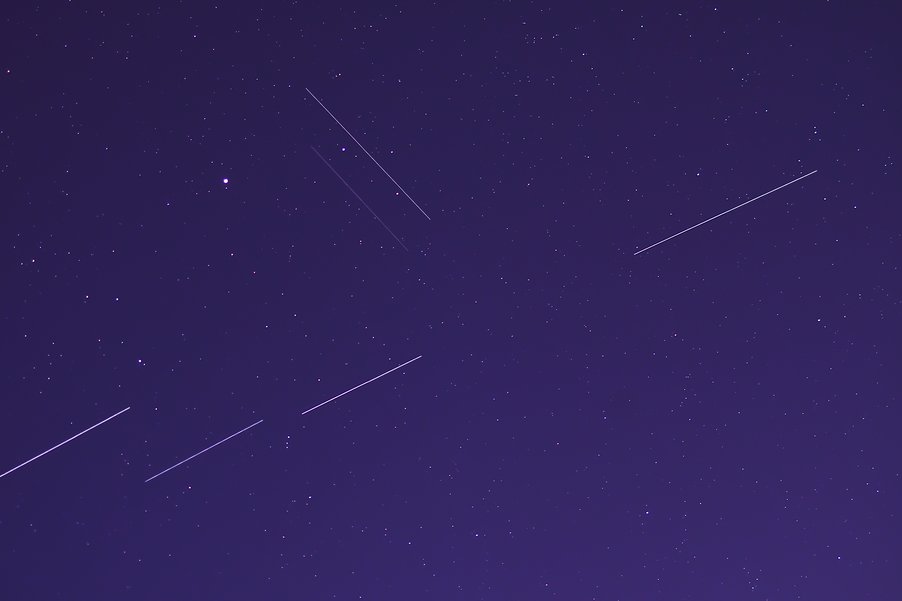 Satellites can leave streaks in the night sky.