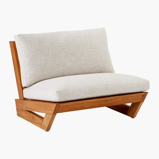 Lounge chair with neutral colored cushion
