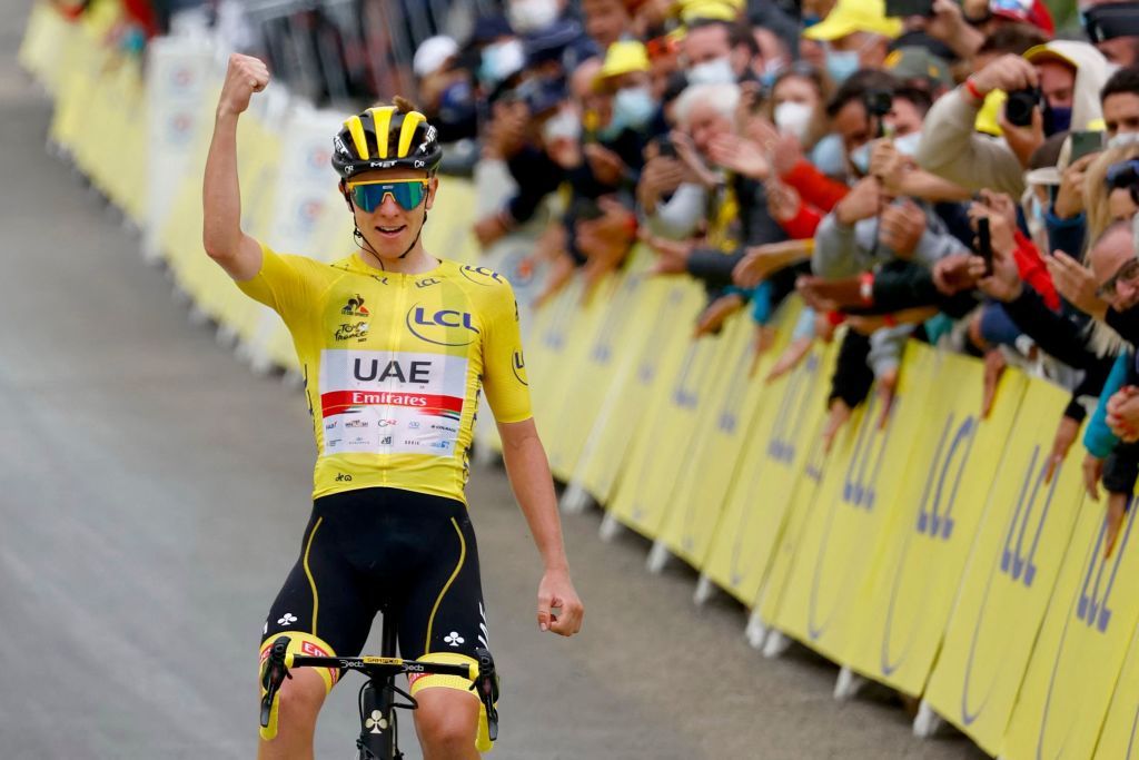Team UAE Emirates Tadej Pogacar of Slovenia wearing the overall leaders yellow jersey celebrates as he crosses the finish line during the 18th stage of the 108th edition of the Tour de France cycling race 129 km between Pau and Luz Ardiden on July 15 2021 Photo by Thomas SAMSON AFP Photo by THOMAS SAMSONAFP via Getty Images