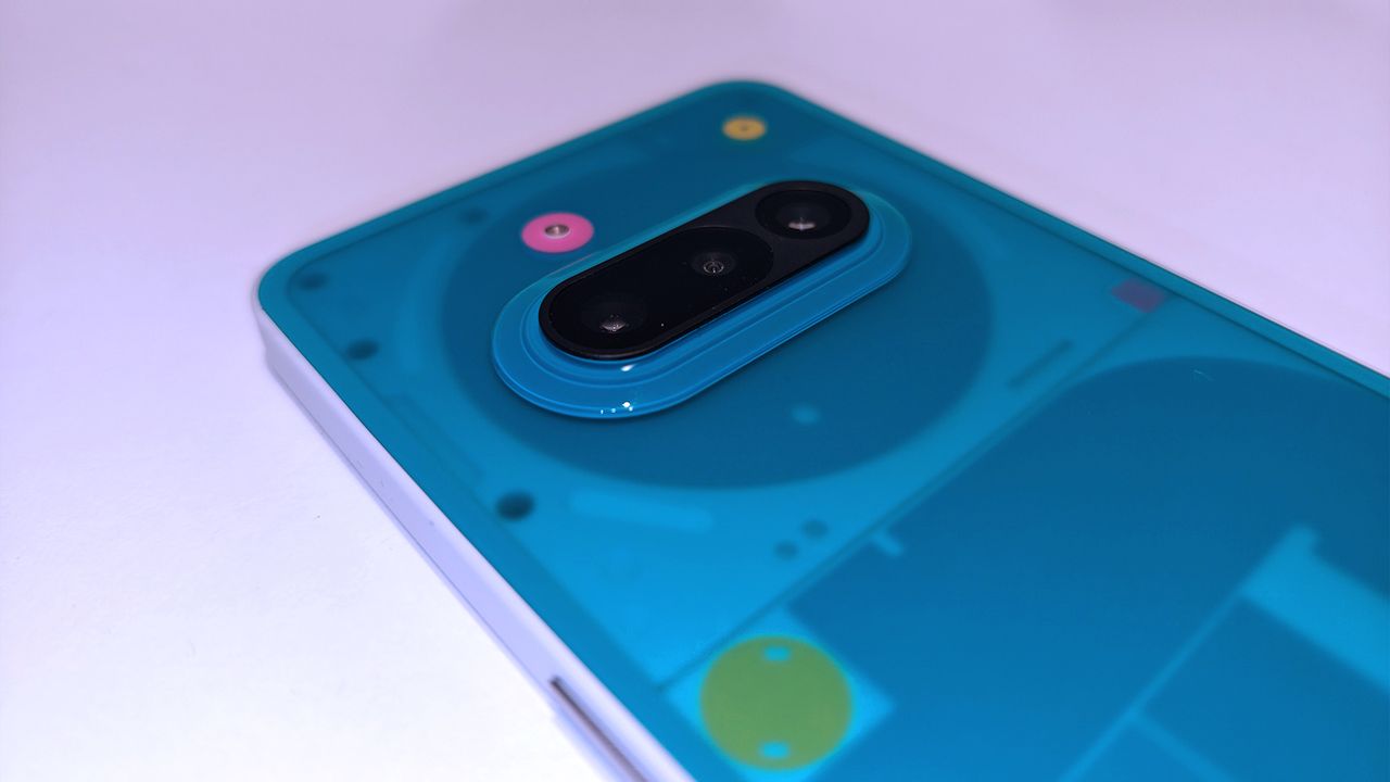 Nothing 3a Community Edition, a green phone on a white table