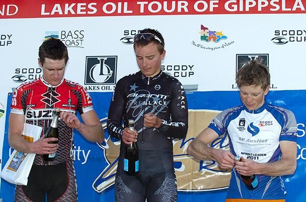 The stage seven podium (l-r): Benjamin Hill (2nd,Suzuki/Trek), Alexander Ray (1st,Pure Black Racing), and Patrick Shaw (3rd,Genesys Wealth Advisers).