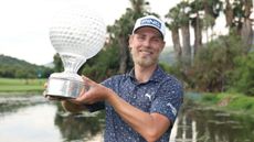 Kristoffer Reitan with the Nedbank Golf Challenge trophy
