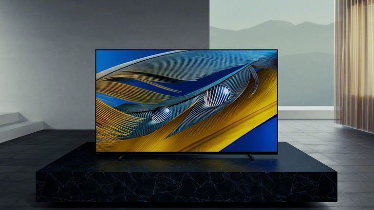 Best Sony TV, image shows Sony A80J in large room with curtains behind it