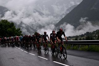 The pack rides during the 9th stage of the 108th edition of the Tour de France cycling race 144 km between Cluses and Tignes on July 04 2021 Photo by AnneChristine POUJOULAT AFP Photo by ANNECHRISTINE POUJOULATAFP via Getty Images