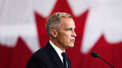 Canadian Prime Minister Mark Carney speaks as he attends a tour of the Fort York Armoury in Toronto