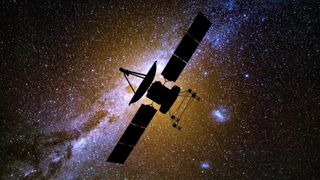 An image of the shadowy outline of a satellite against the stars of the Milky Way