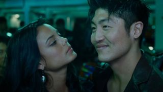 Brian Tee and Nathalie Kelley looking at each other in Tokyo Drift
