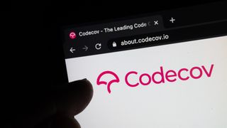 Somebody pointing to the CodeCov logo as seen on its website accessed through a web browser 