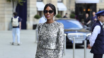 Naomi Campbell wearing a silver metallic Chanel skirt set to the Chanel show at Paris Couture Fashion Week June 2024