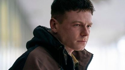 Young Ruben looks at something offscreen