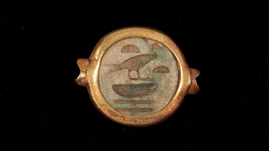 This gold ring has a hieroglyphic inscription with the name "Sat I Plant Tawi," which means "Lady of the Earth."