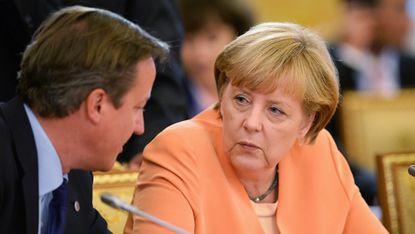 SAINT PETERSBURG - SEPTEMBER 05:In this handout image provided by Host Photo Agency, German Chancellor Angela Merkel (R) and British Prime Minister David Cameron attend the first working meet
