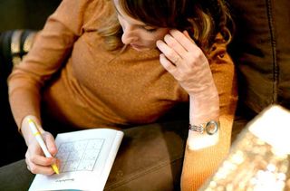 Woman doing Sudoku