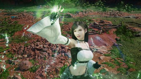 Tifa where's a mage-like outfit as her hand glows green in Final Fantasy 7 Revelation