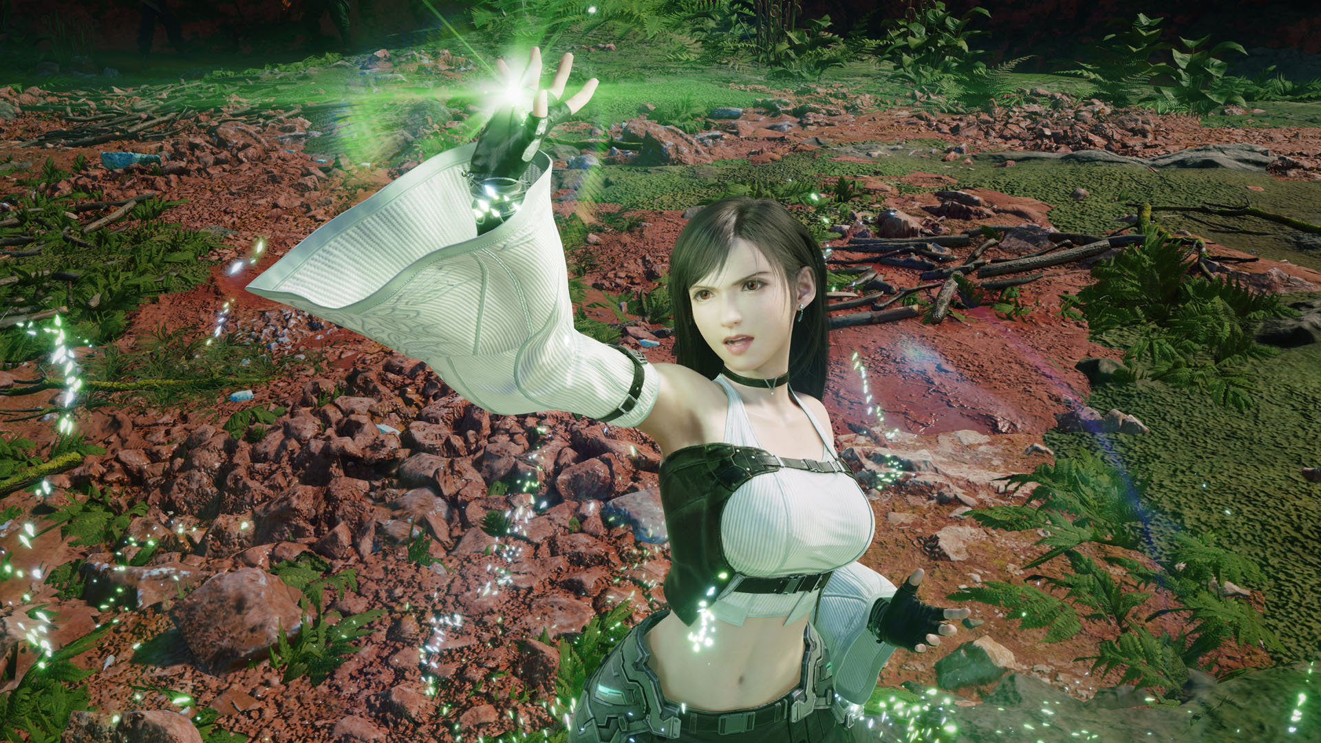 Tifa where's a mage-like outfit as her hand glows green in Final Fantasy 7 Revelation