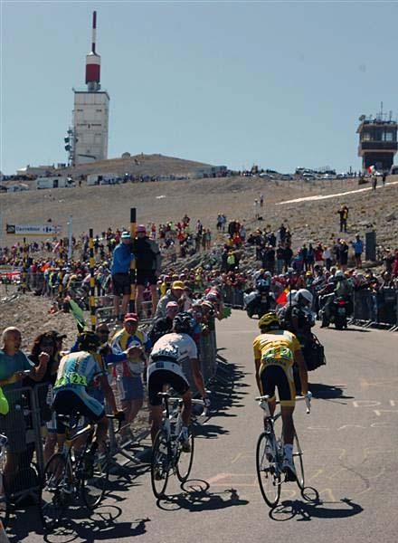 The GC men dance on their pedals near the top.