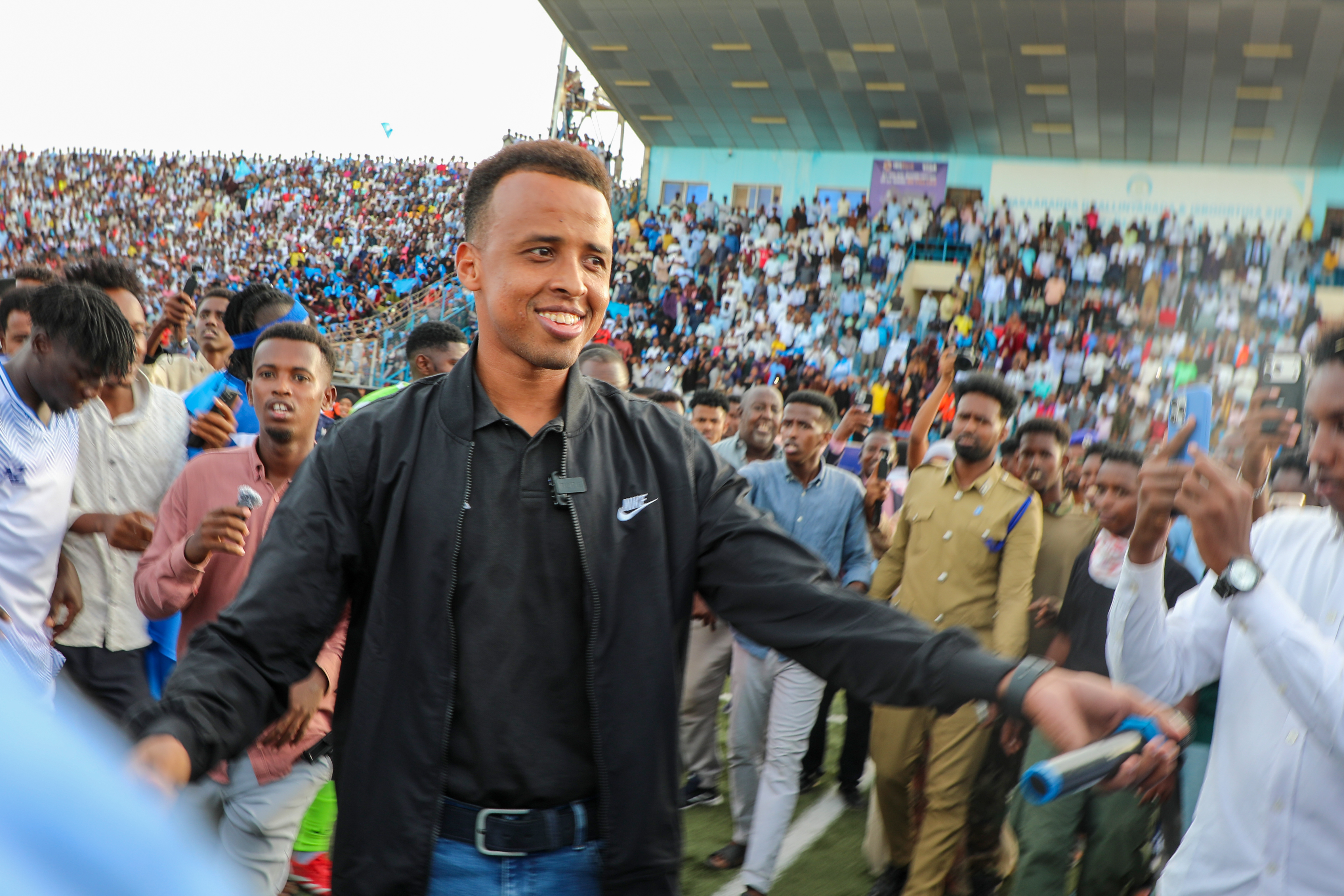 MOGADISHU, SOMALIA - JUNE 10: Somali referee Omar Abdulkadir Artan greets fans who show support for him, after he was denied entry into the United States where he had traveled to take part in the World Cup organization and was forced to return to his country, in Mogadishu, Somalia on June 10, 2026. (Photo by Abuukar Mohamed Muhidin/Anadolu via Getty Images)