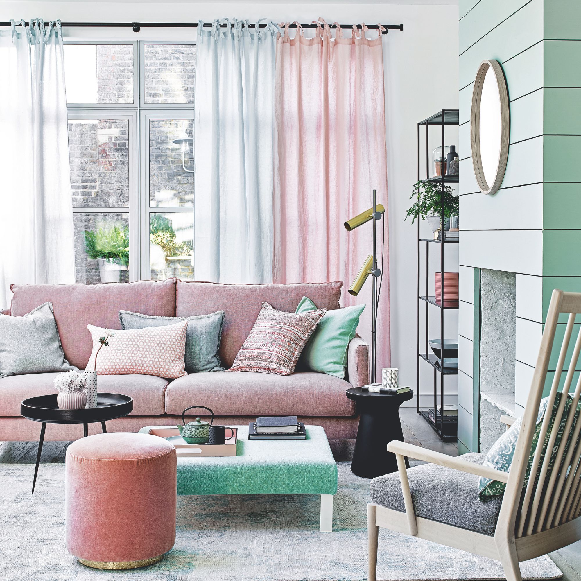 A blue and pink living room with natural accents