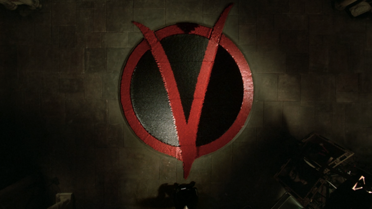 Overhead shot of the V symbol in dominoes in V For Vendetta