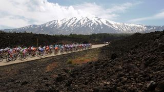 The peloton rides to Mount Etna during the Giro d'Italia