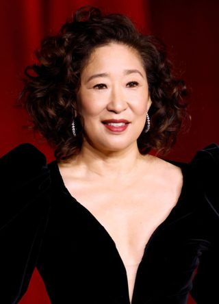 Actress Sandra Oh in a plunging black gown