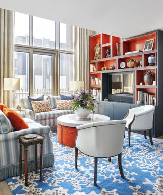 Living room with orange and blue shelves