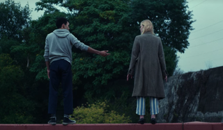 Justice Smith and Elle Fanning on bridge in All the bright Places
