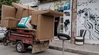 A van is packed with furniture from the closures of the beauty salons across Afghanistan