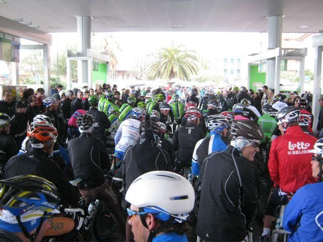 Racers try to stay dry before the second start.