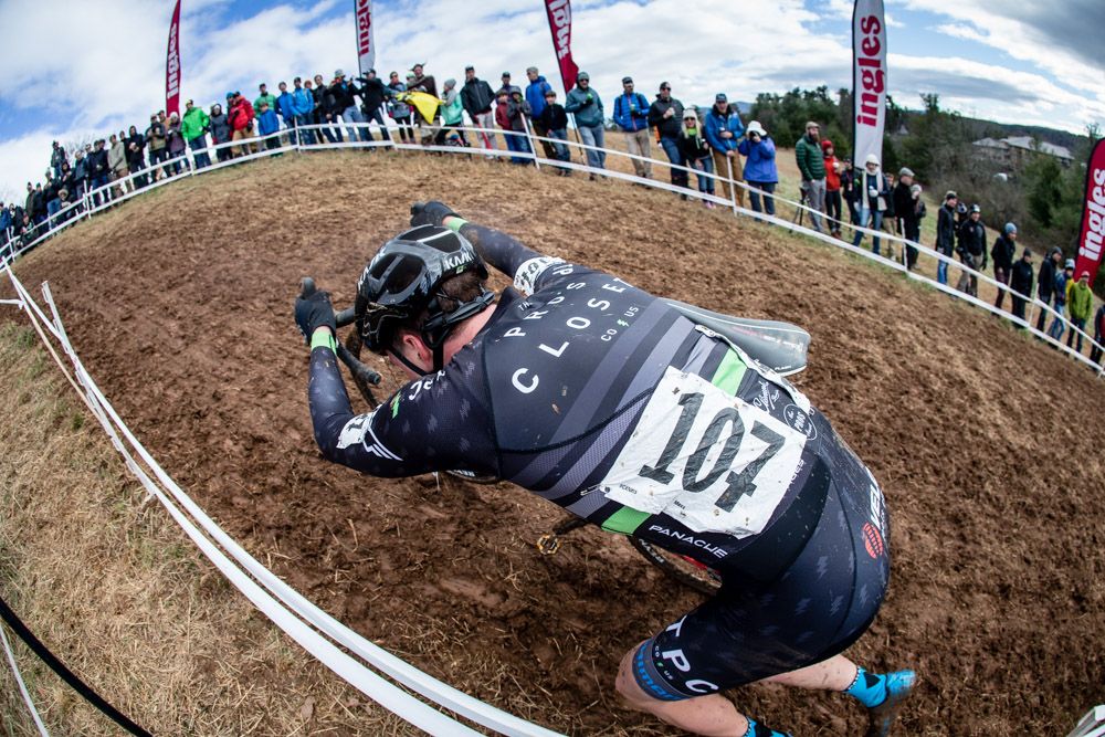 Maxx Chance (Pros Closet) pushes his way up the muddy climb in the U23 race