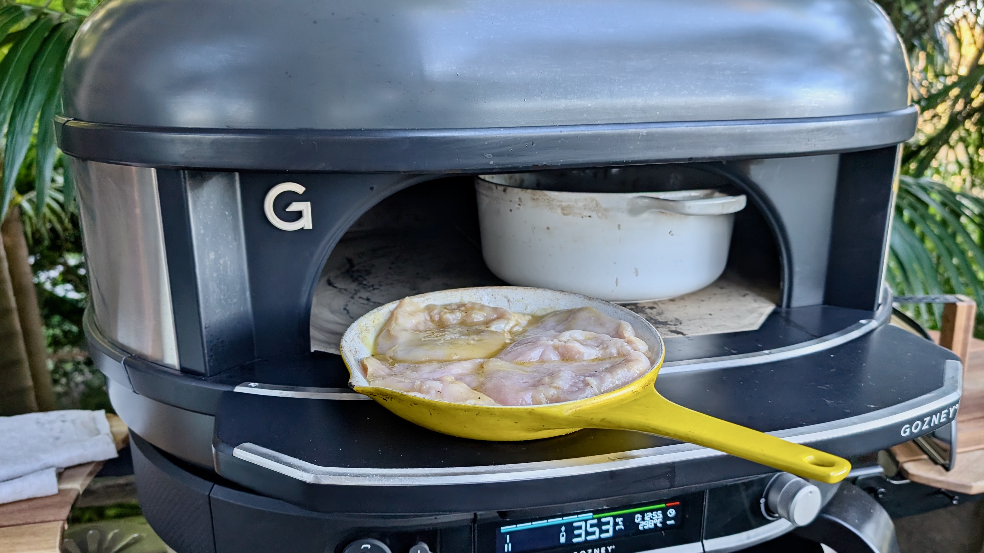 Uncooked food being put in the Gozney Dome (Gen 2)
