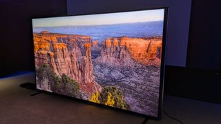 Hisense 110UXN with valley during sunrise on screen