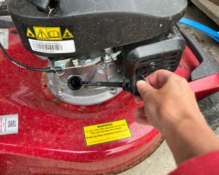 checking the oil levels on a Mountfield HP185 139cc lawn mower