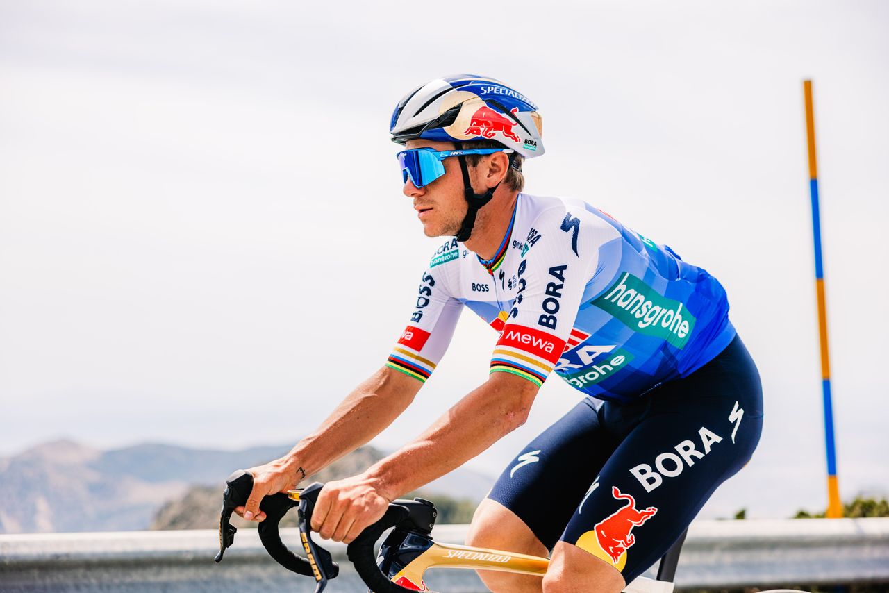 Red Bull Bora Hansgrohe kit for the 2026 Tour de France, featuring a blue gradient on a white jersey with black shorts