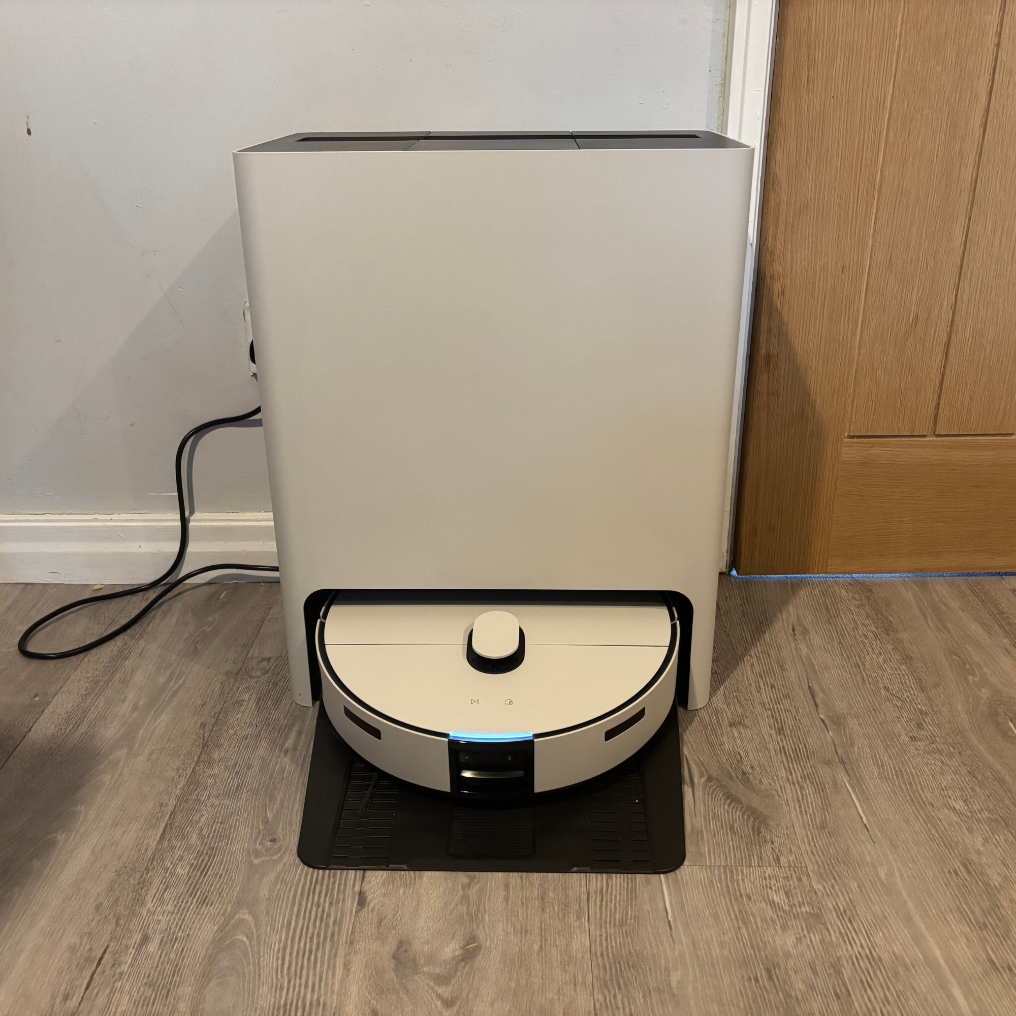 Front view of the Samsung Jet Bot Combo Clean Station with charging light lit up in white