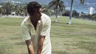 Dean Martin holding a golf club