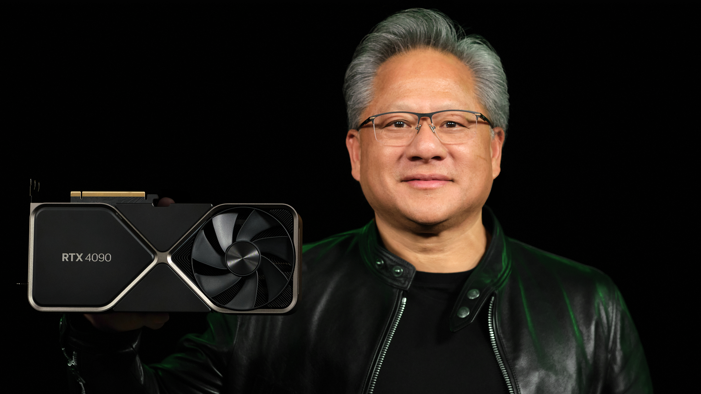 Nvidia GeForce RTX 4090 being held by Nvidia CEO Jensen Huang