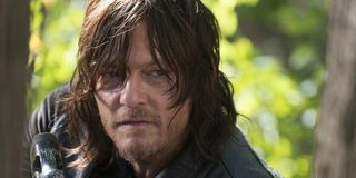 Daryl Dixon (Norman Reedus) ready to take down walkers in AMC's The Walking Dead
