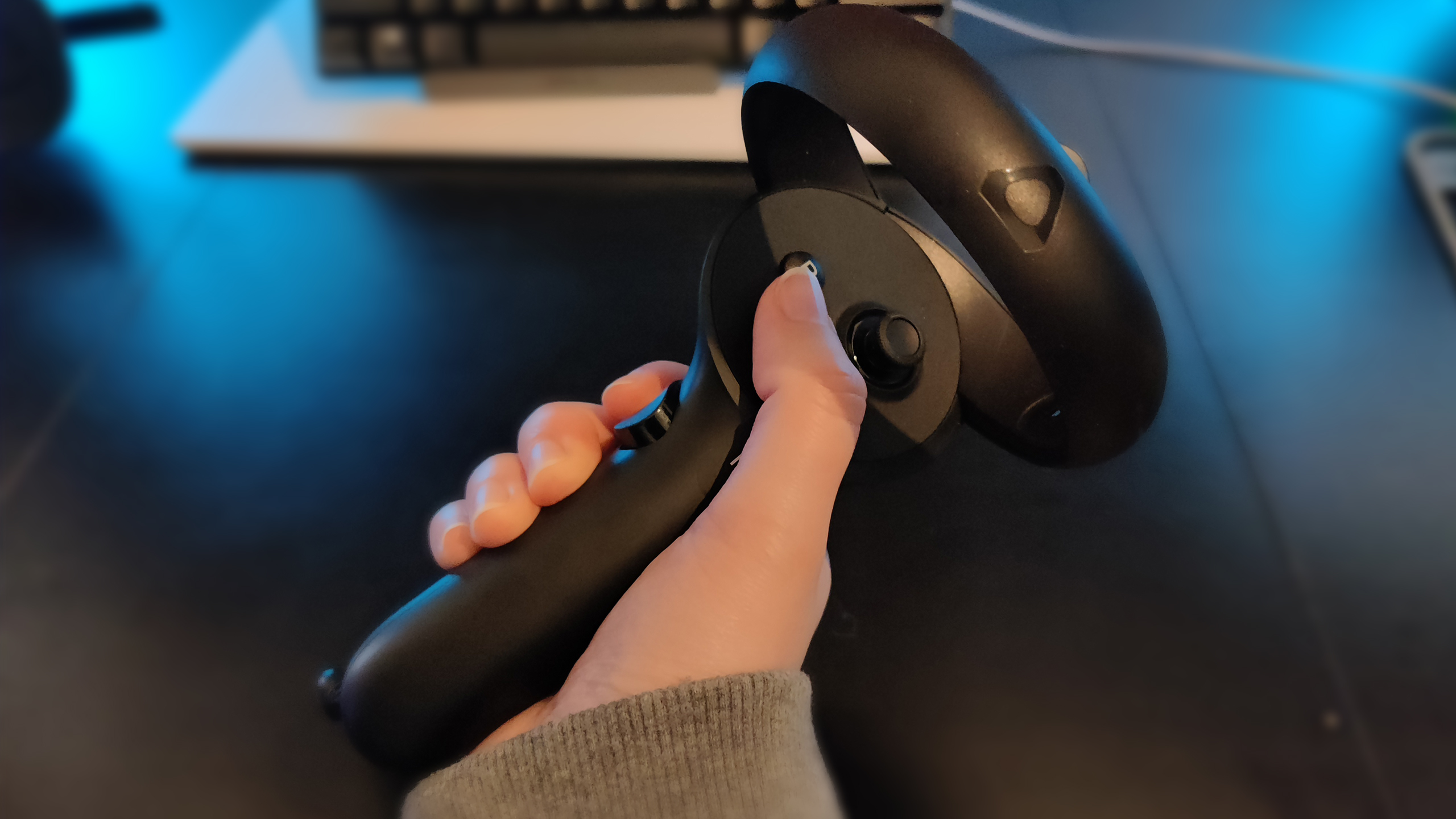 The HTC Vive XR Elite controller in hand