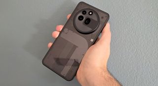 The Nothing Phone (3a) Pro held in hand