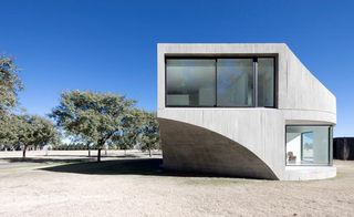 curved façade is punctuated by a series of generous windows