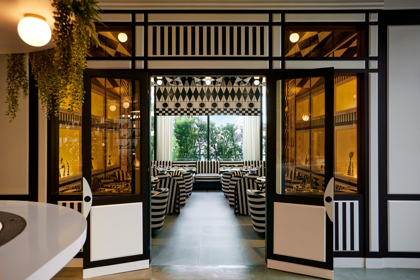 Black and white furniture in Tease, a tearoom in The Standard Bangkok hotel designed by Jaime Hayon