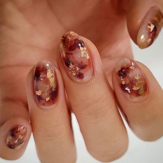 Gold nail polish design.