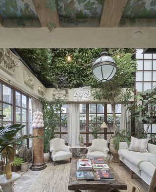 Maison Colbert with green interiors and triple height ceilings