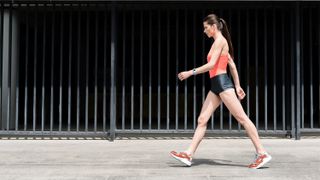 a woman walking at a brisk pace