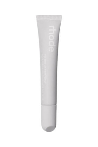 An unopened gray tube of Rhode peptide lip treatment against a white background.