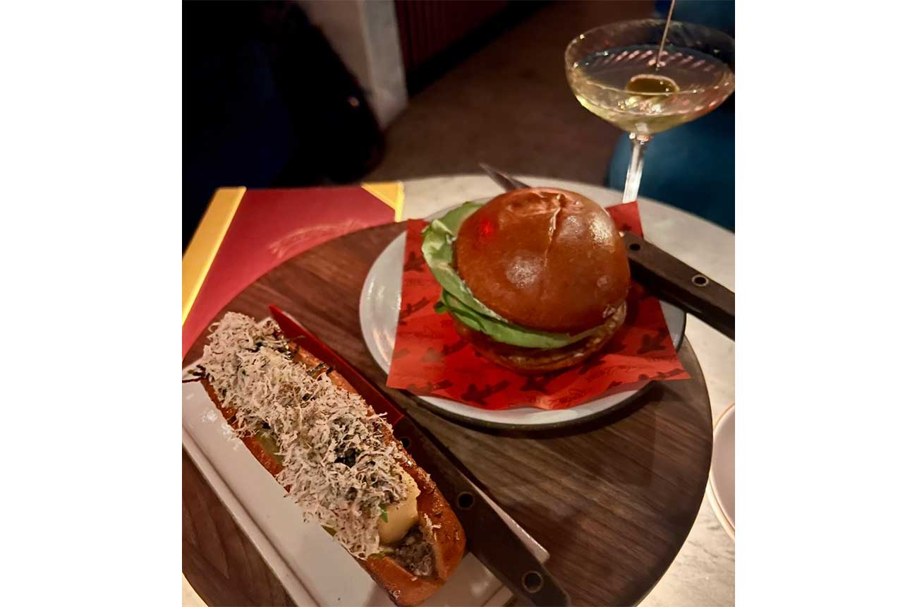 Burger and cocktail on table