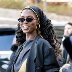 a black woman with long, curly hair
