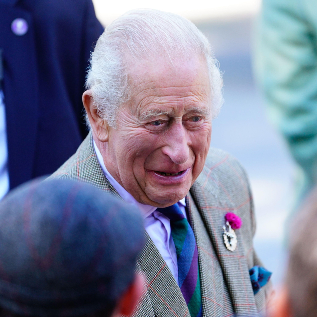 King Charles laughing as he talks to fans